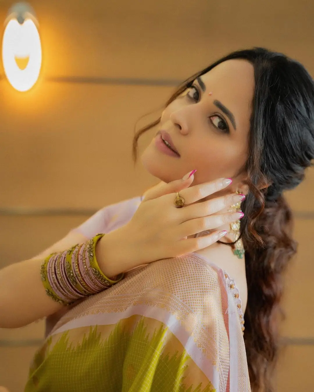 Anasuya Bharadwaj Wearing Beautiful Earrings Bangles Green Saree